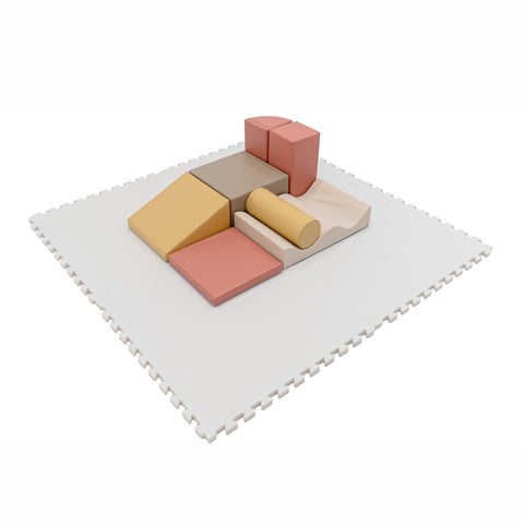 3. White foam puzzle mat with colorful foam blocks arranged on top