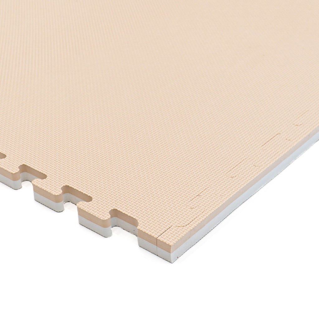 10. Close-up of beige foam puzzle mat showing texture and interlocking edge