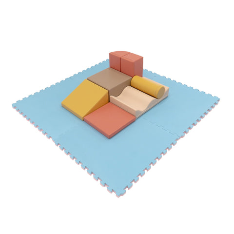 3. Blue foam puzzle mat with colorful play blocks on top, showcasing playroom setup