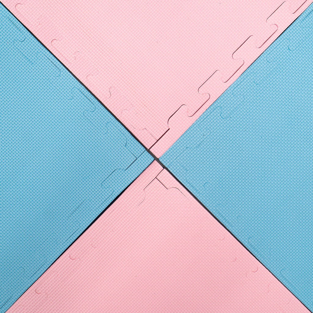 11. Close-up of interlocked baby pink and baby blue foam puzzle mats, showing texture