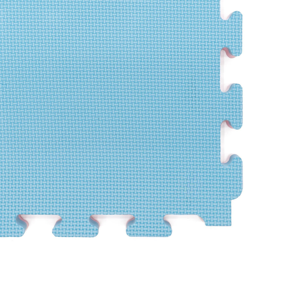 6. Close-up of interlocking edge of blue foam puzzle mat, highlighting texture and thickness