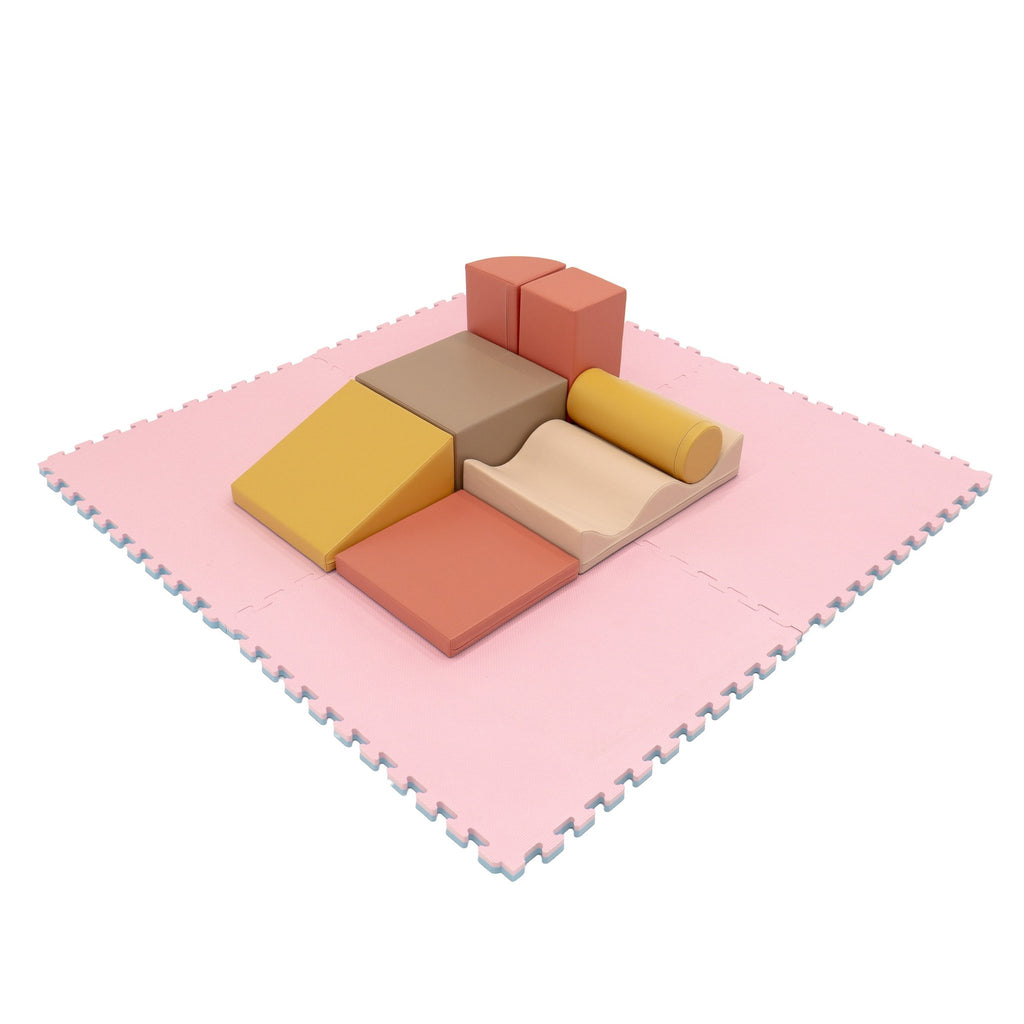 4. Pink foam puzzle mat with colorful play blocks on top, ideal for playroom use