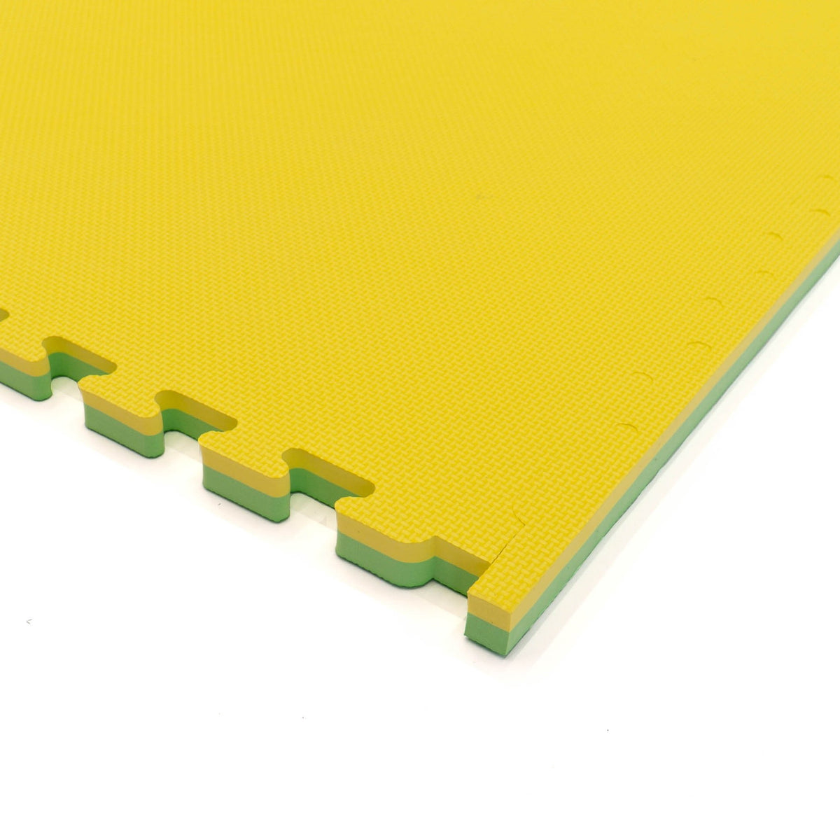 3. Close-up of yellow IGLU foam puzzle mat edge showing interlocking design with green layer