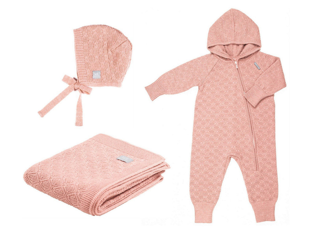 5. Pink merino wool baby gift set with blanket, romper, and bonnet on white background