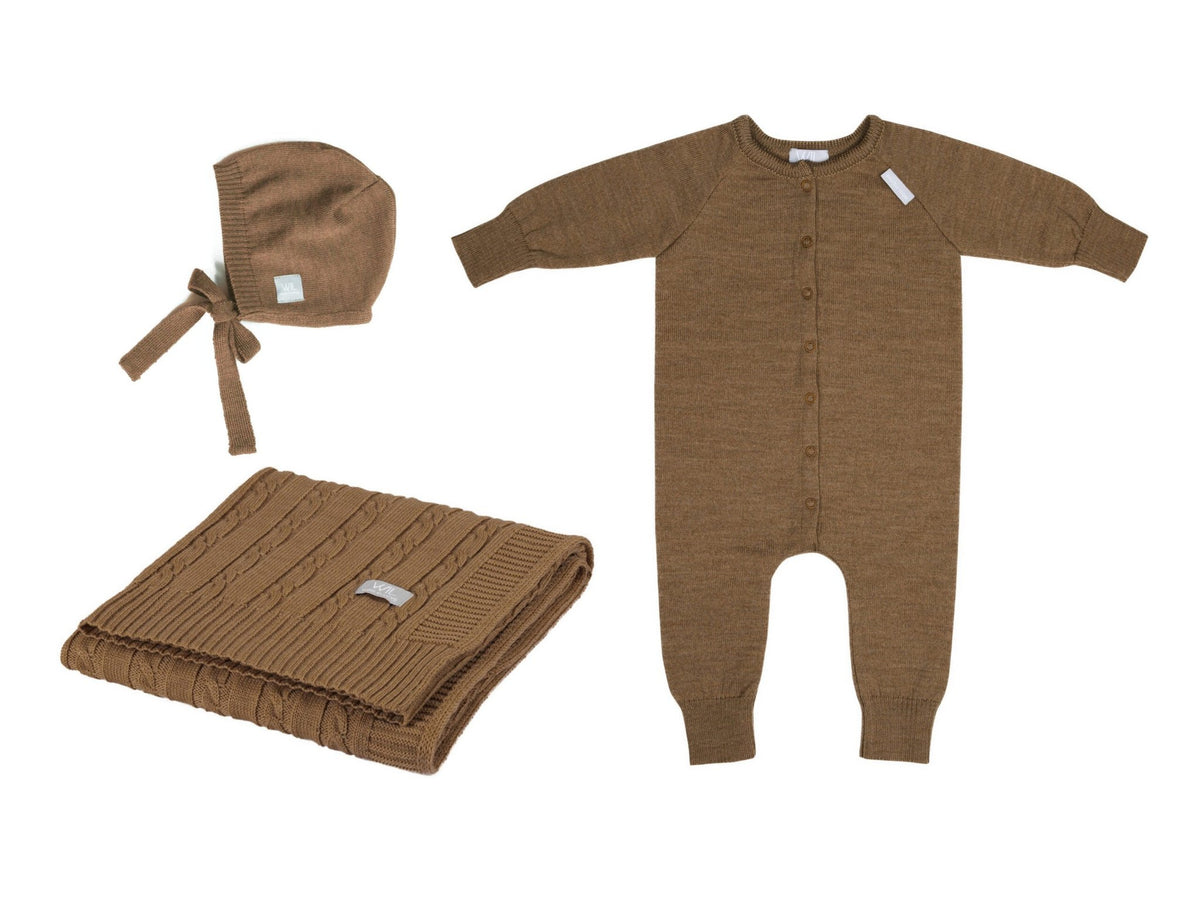7. Flat lay of brown merino wool baby gift set including romper, bonnet, and braided blanket