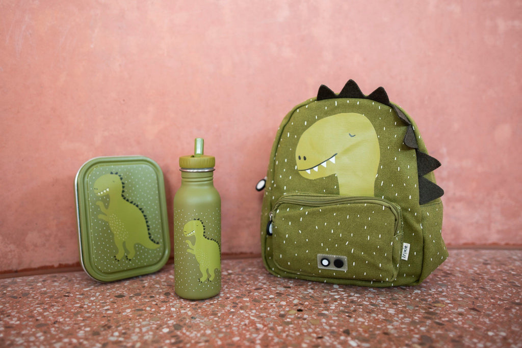 1. Green dinosaur-themed lunch box, bottle, and backpack set against a pink wall