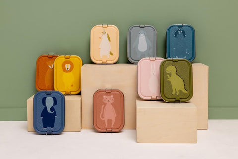 1. Collection of colorful lunch boxes with animal designs on wooden blocks