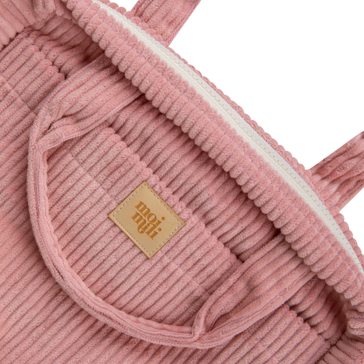 3. Close-up of Moi Mili logo on ribbed baby pink makeup bag