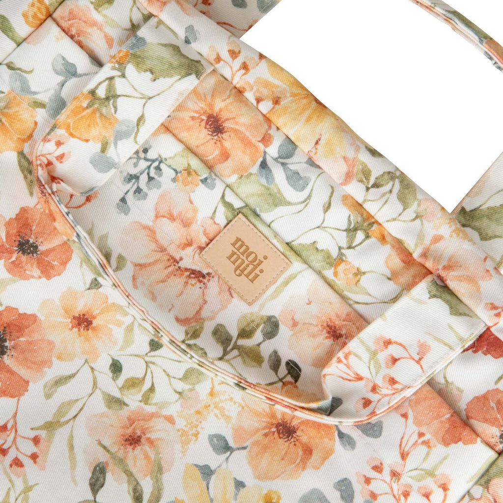 3. Close-up of floral print on large makeup bag with visible moi mili logo tag