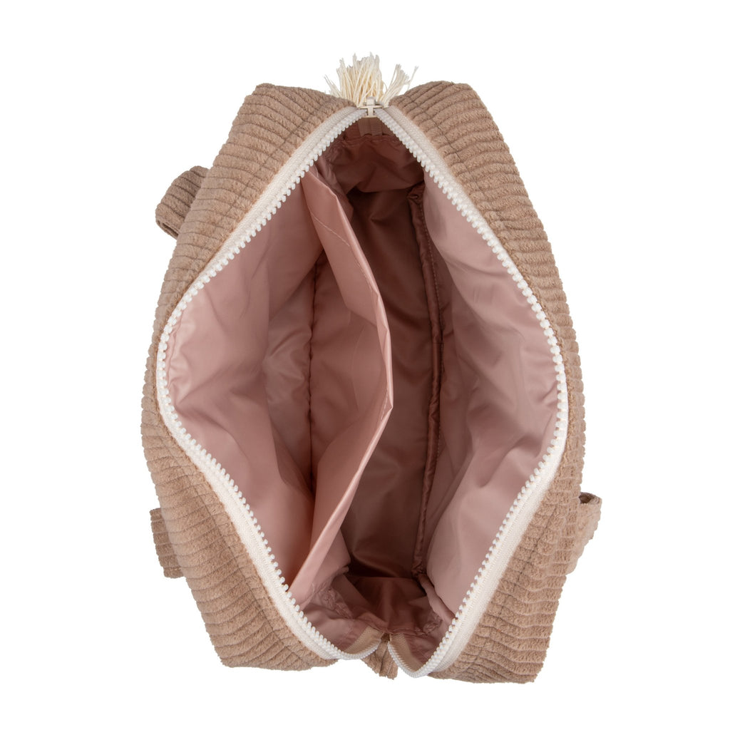 3. Interior view of latte-colored makeup bag showing pink waterproof lining and spacious compartments