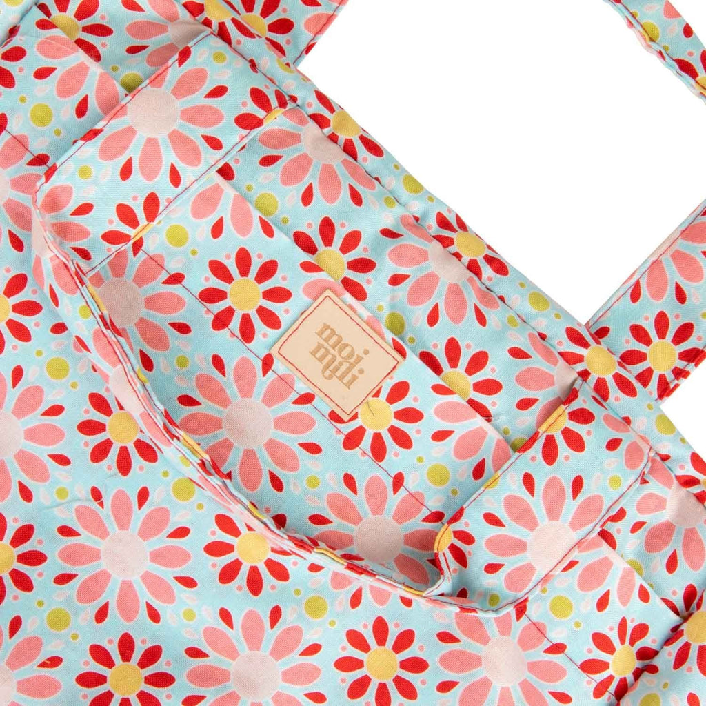 3. Close-up of floral print and Moi Mili logo on large makeup bag
