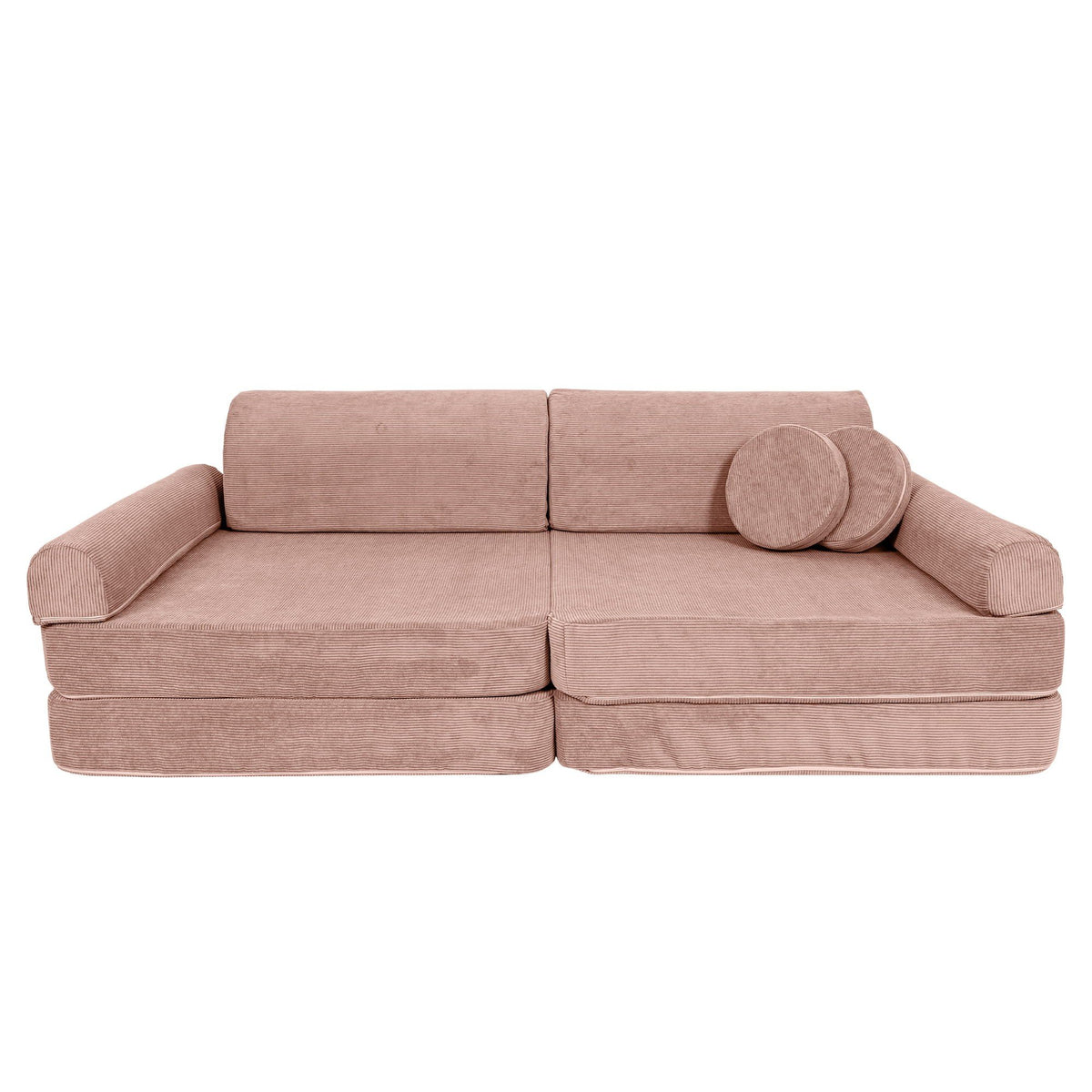 1. Large pink modular sofa for kids in slimcord corduroy with two round cushions, shown in a studio setting