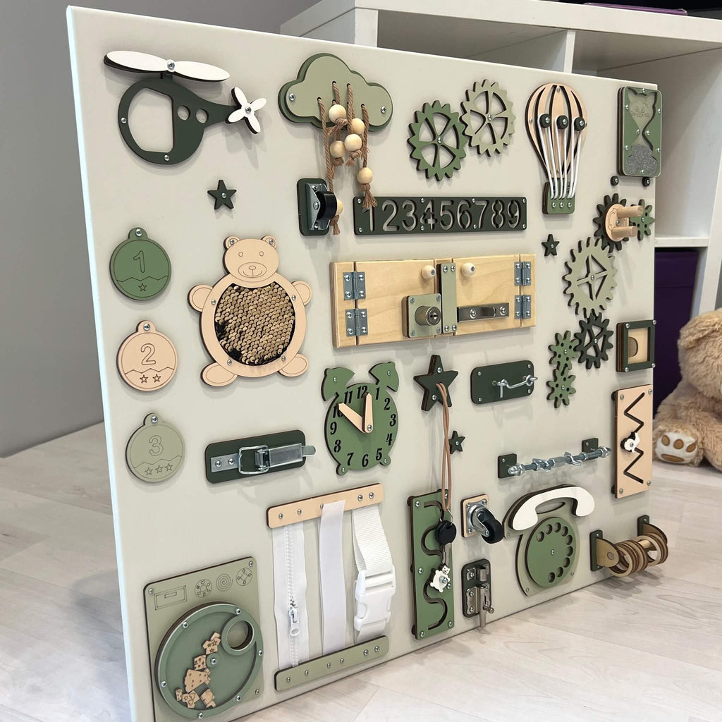 4. Side view of Montessori busy board with green and beige elements, showcasing interactive features for children's development.