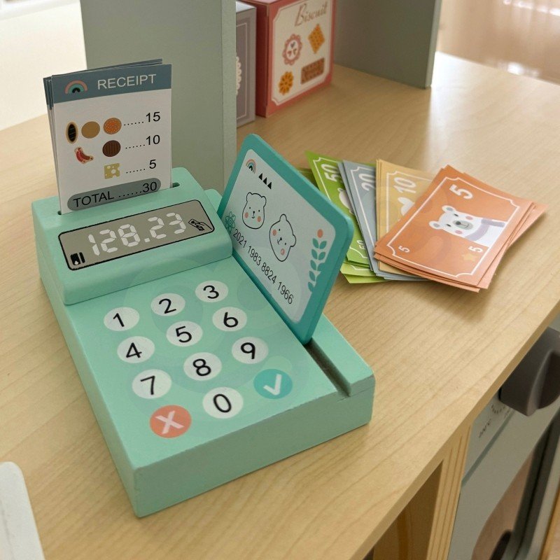 6. Close-up of card reader and play money on Woopie Green wooden food truck