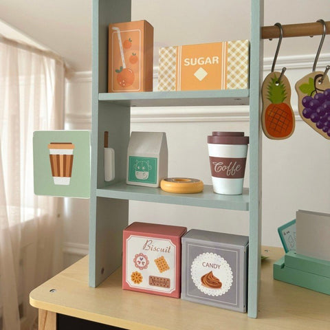 2. Close-up of shelves with play food items on Woopie Green wooden food truck