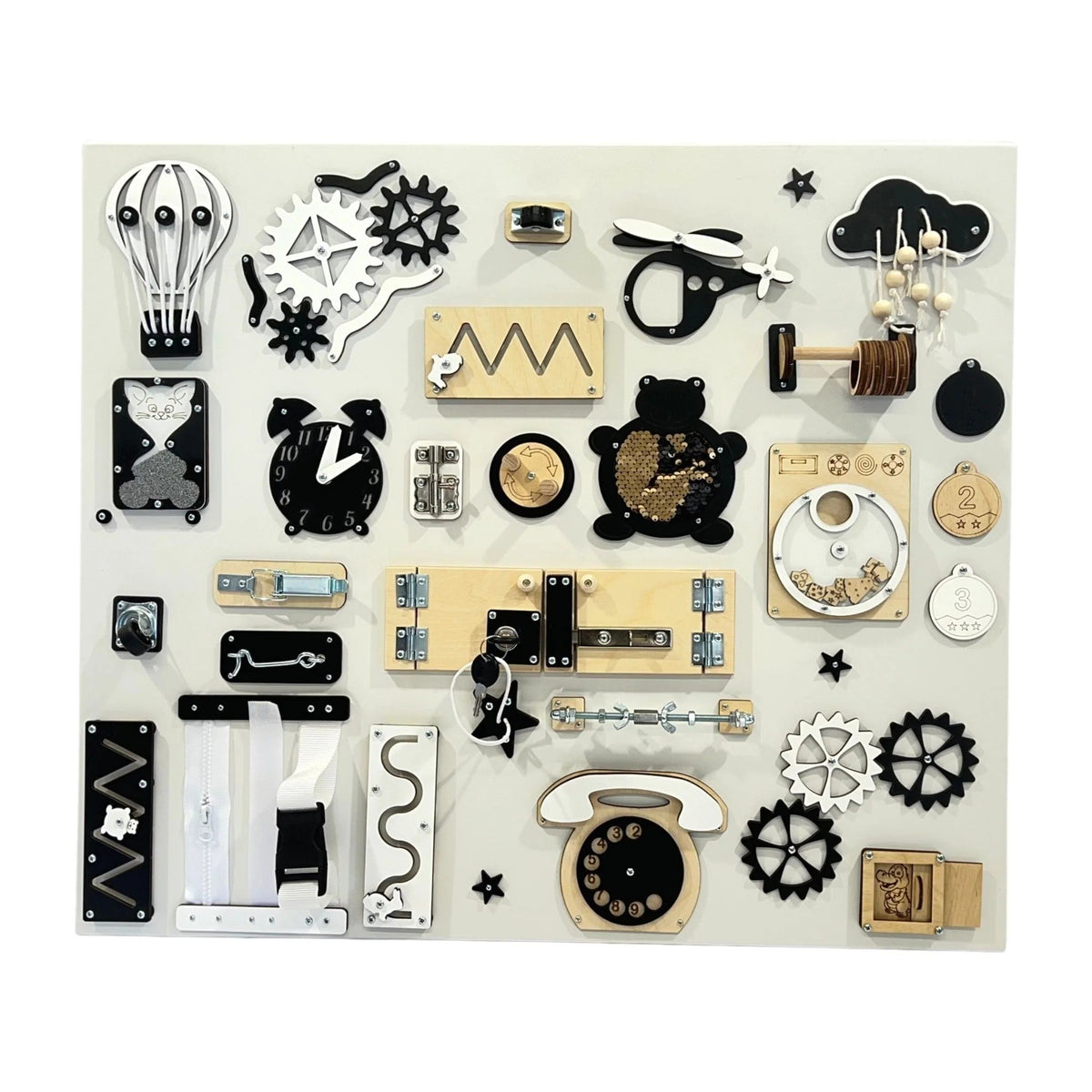 1. Large wall busy board with black and white elements including gears, locks, and a telephone on a white background