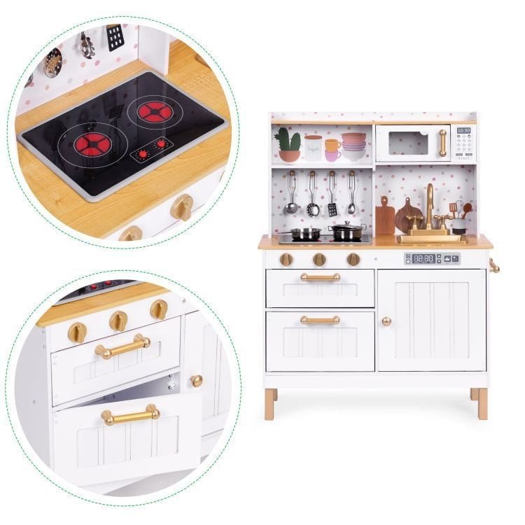 7. White play kitchen with close-up of stove and oven, featuring a sink and hanging utensils, set against a white background.