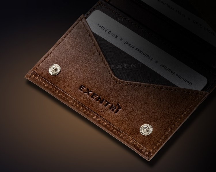 6. Close-up of brown EXENTRI Miniwallet showing embossed logo and card slots