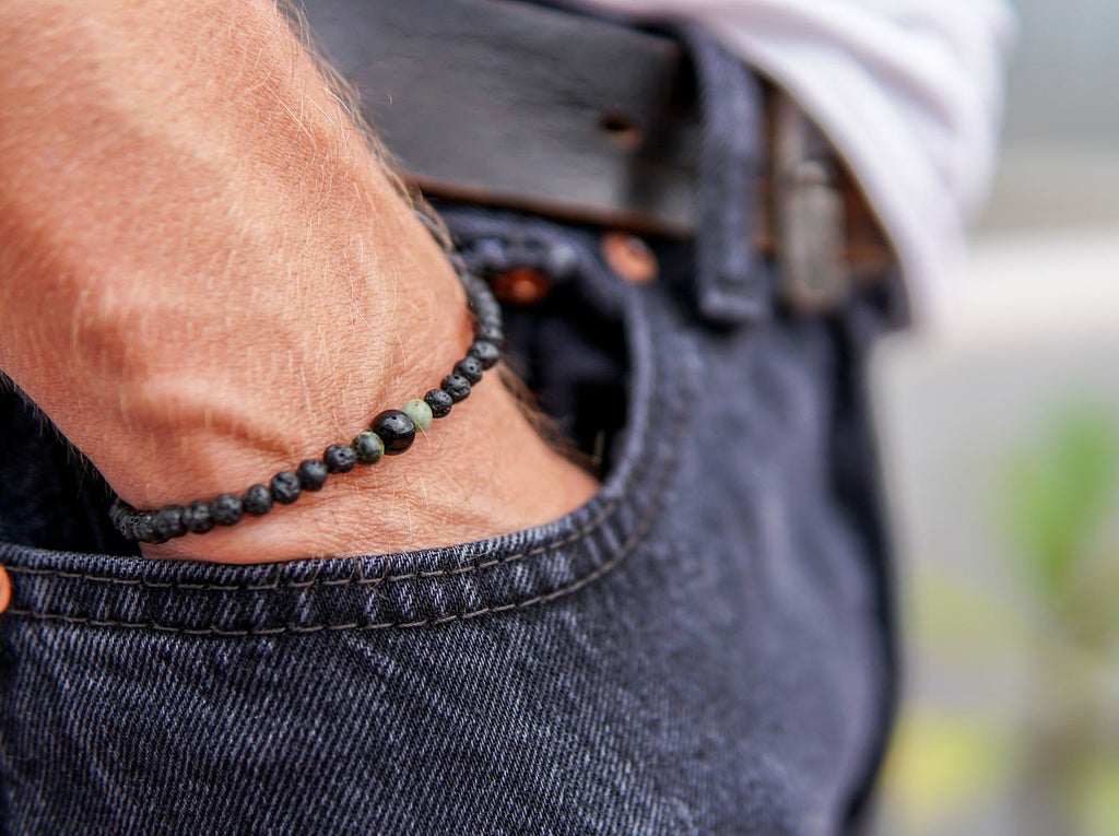 1. Men's lava bracelet with onyx and turquoise beads by Canary Lava, worn on wrist with casual jeans
