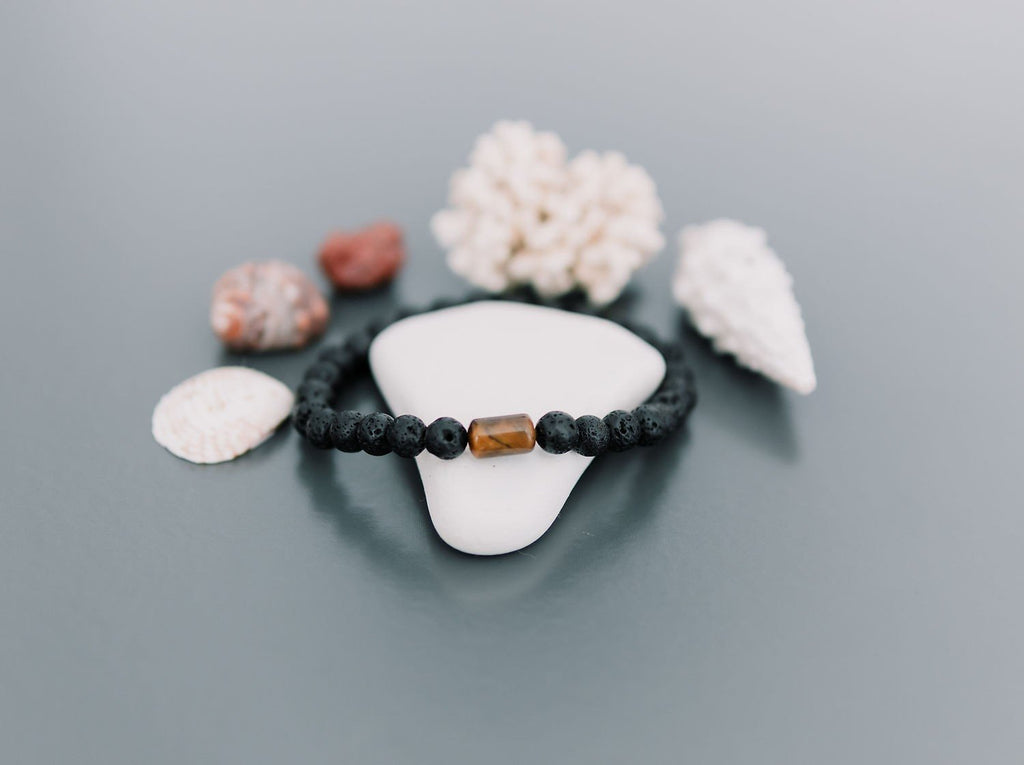 4. Men's Canary Lava bracelet with tiger eye bead surrounded by seashells