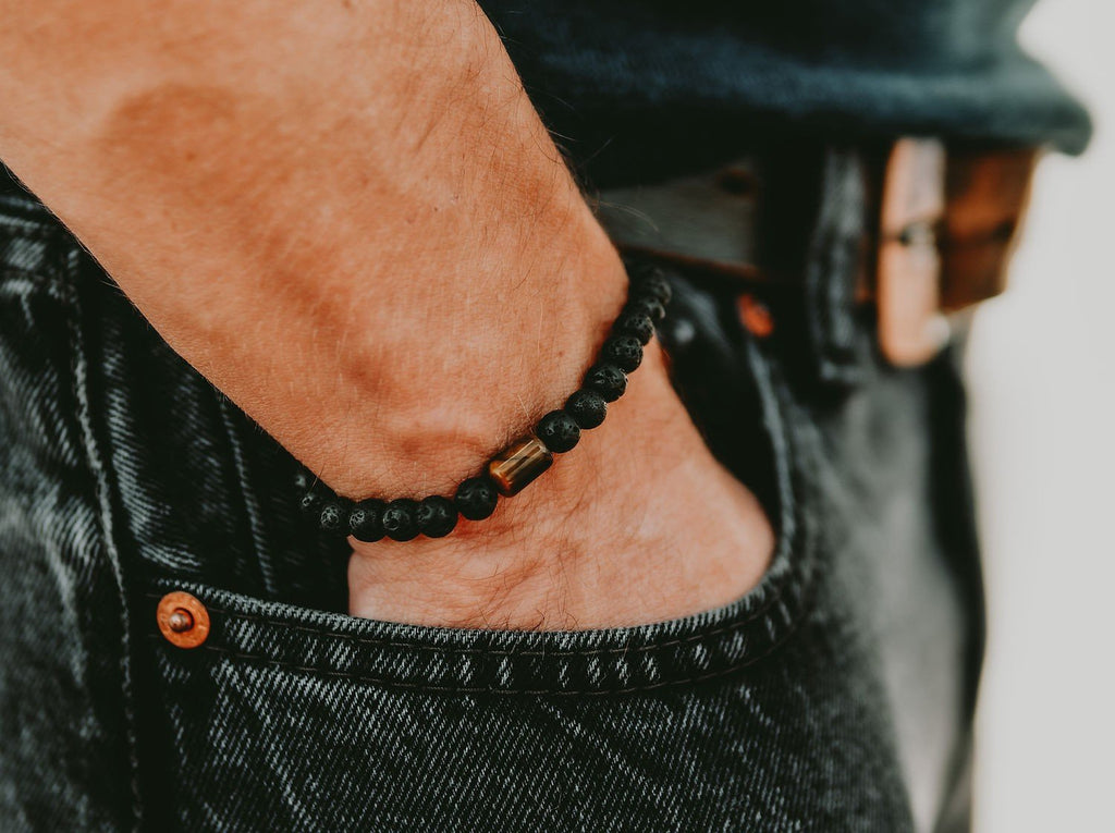 1. Men's Canary Lava bracelet with 6mm lava stones and tiger eye bead, worn with casual jeans