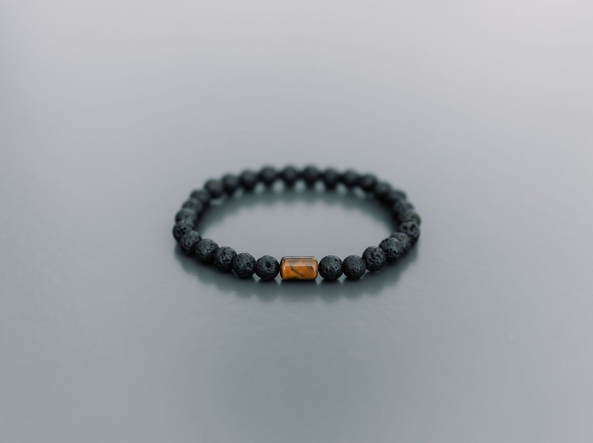 5. Studio shot of men's Canary Lava bracelet with 6mm lava stones and tiger eye bead