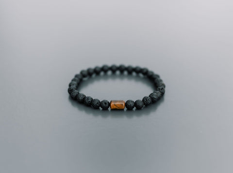 5. Studio shot of men's Canary Lava bracelet with 6mm lava stones and tiger eye bead