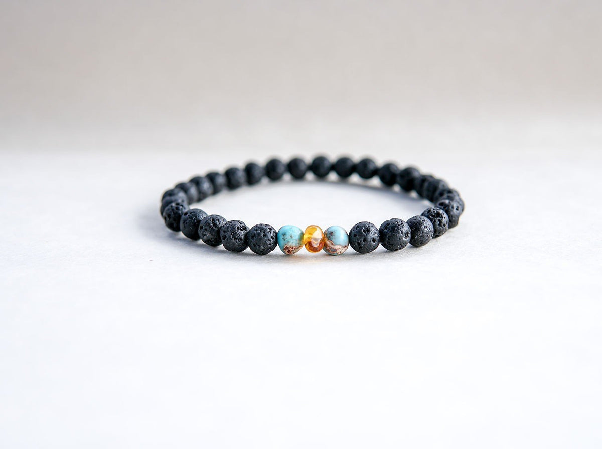 2. Studio image of Canary Lava stone bracelet featuring amber and turquoise beads