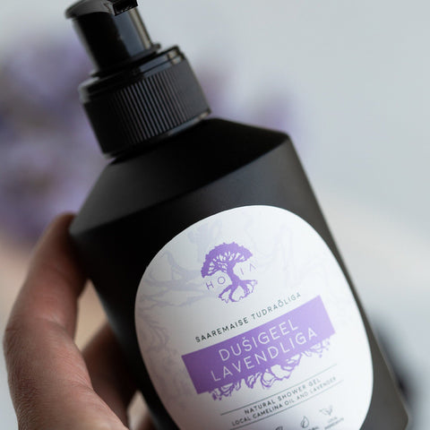 2. Close-up of HOIA homespa Lavender Shower Gel 200ml bottle held in hand