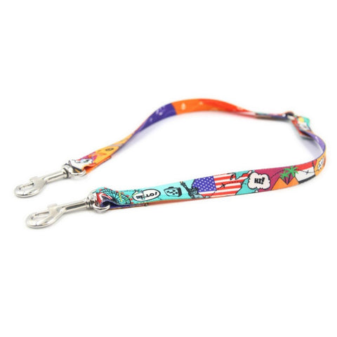 1. Colorful Matteo leash splitter with travel-themed print and metal clips on white background