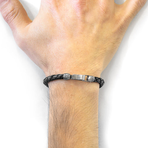 1. Men's black braided leather bracelet with sterling silver clasp by ANCHOR & CREW, shown on wrist