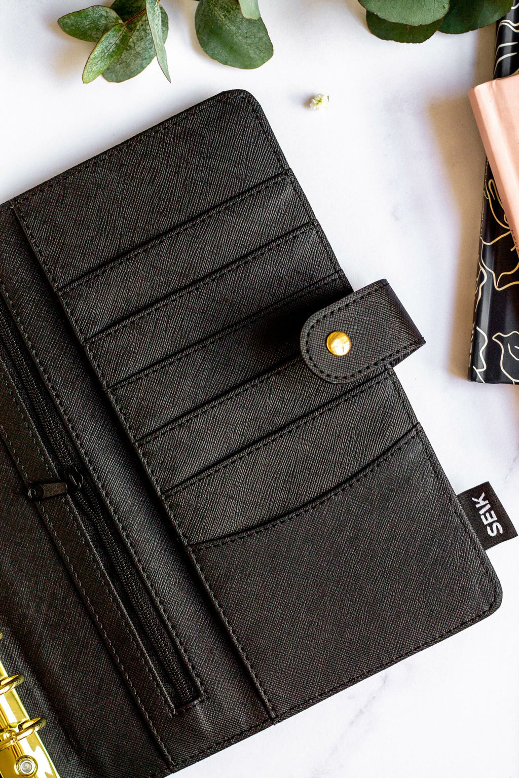 2. Interior view of SEIK Premium Dream Plan Do Notebook showing multiple card slots and zipper pocket in black vegan leather