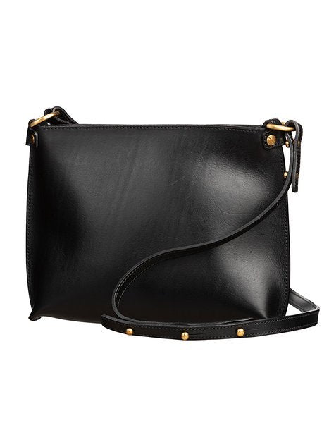 2. Black leather Stella Soomlais handbag with adjustable strap and gold hardware, studio setting