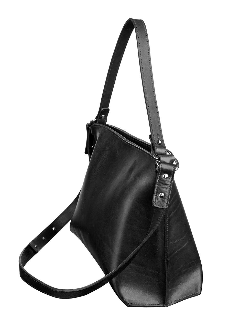 5. Side view of Stella Soomlais black leather handbag in studio, highlighting adjustable strap and sleek silhouette.
