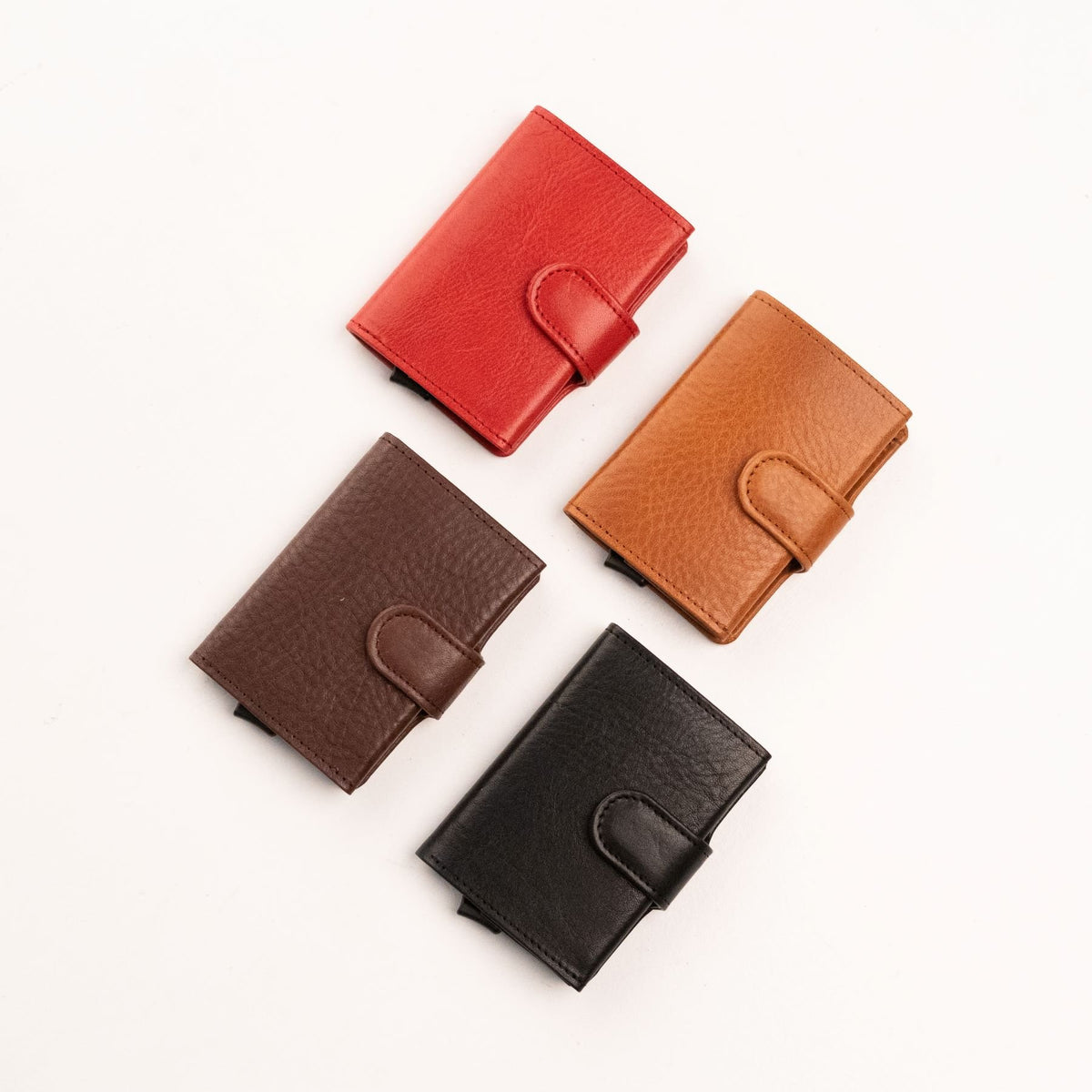 3. Papillon Leather Wallet 40-25 in red, cognac, dark brown, and black, shown closed to display color options