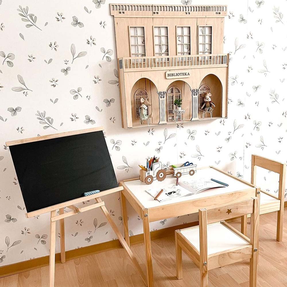 1. Study corner in children's room with Dekornik Leaves Minimini wallpaper, wooden desk, and chalkboard