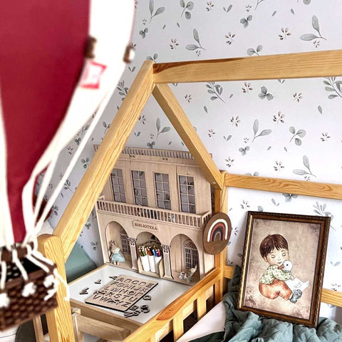 1. Children's room with Dekornik Leaves Minimini wallpaper, wooden house bed, and hot air balloon decor