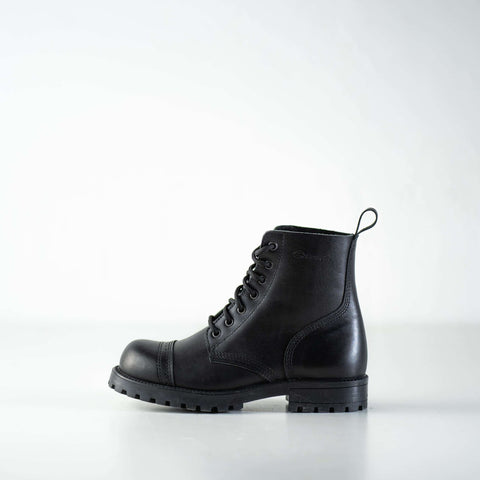 4. Close-up of Samelin 517 Aviator Boots in black, worn with green coat and jeans