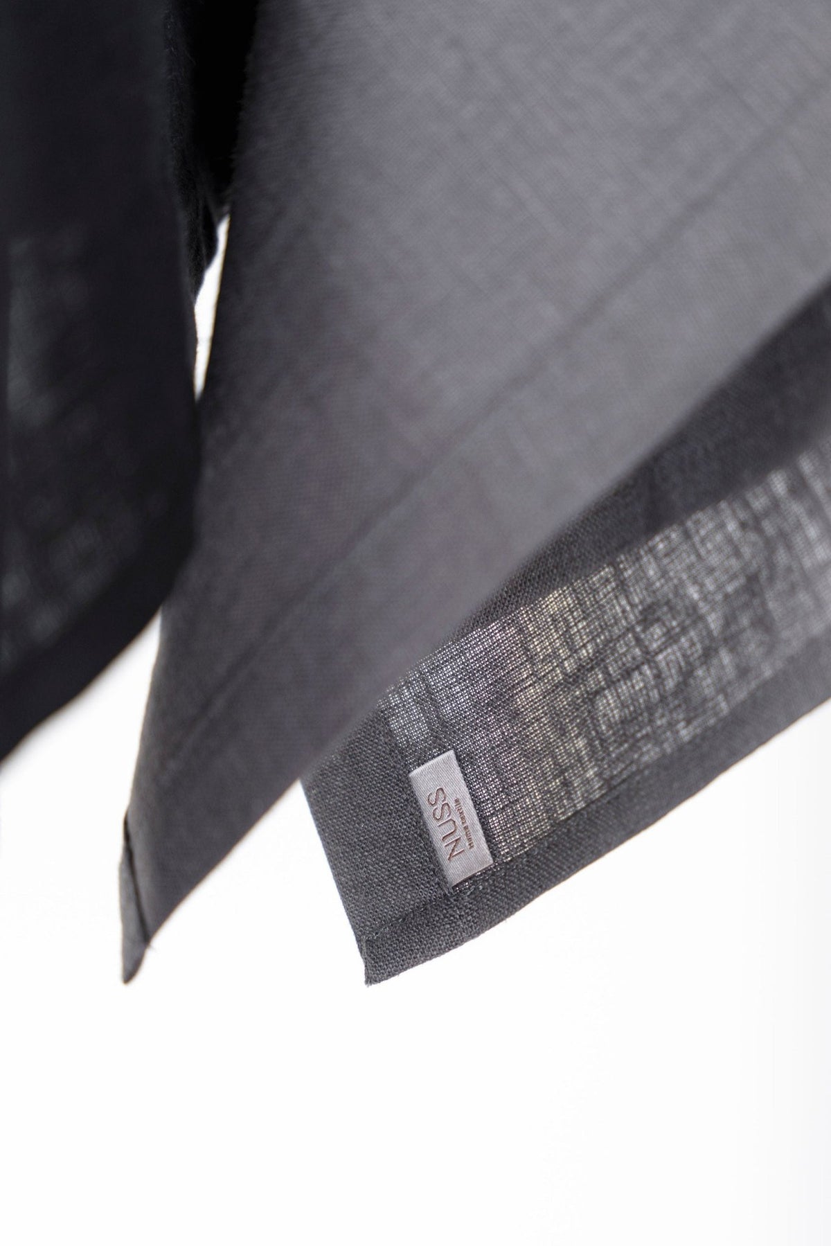 5. Close-up of gray linen kitchen towel with Nuss brand label
