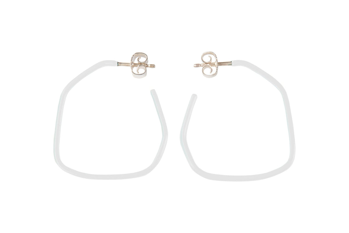 8. Studio image of Lisa Kroeber Jewellery Lines Earrings in white