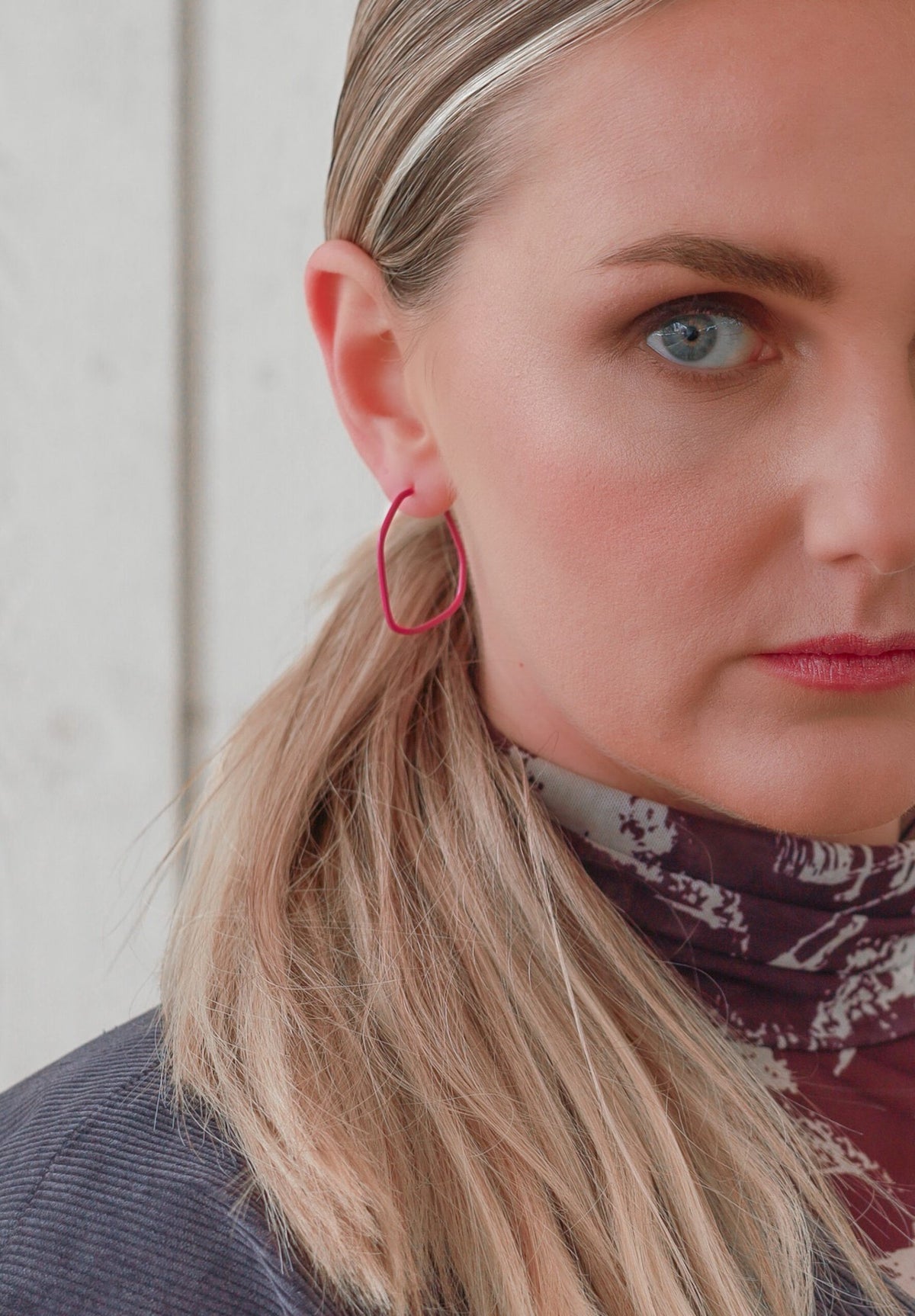 3. Close-up of woman wearing Lisa Kroeber Jewellery Lines Earrings