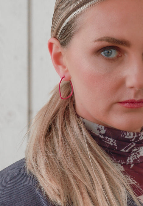 3. Close-up of woman wearing Lisa Kroeber Jewellery Lines Earrings