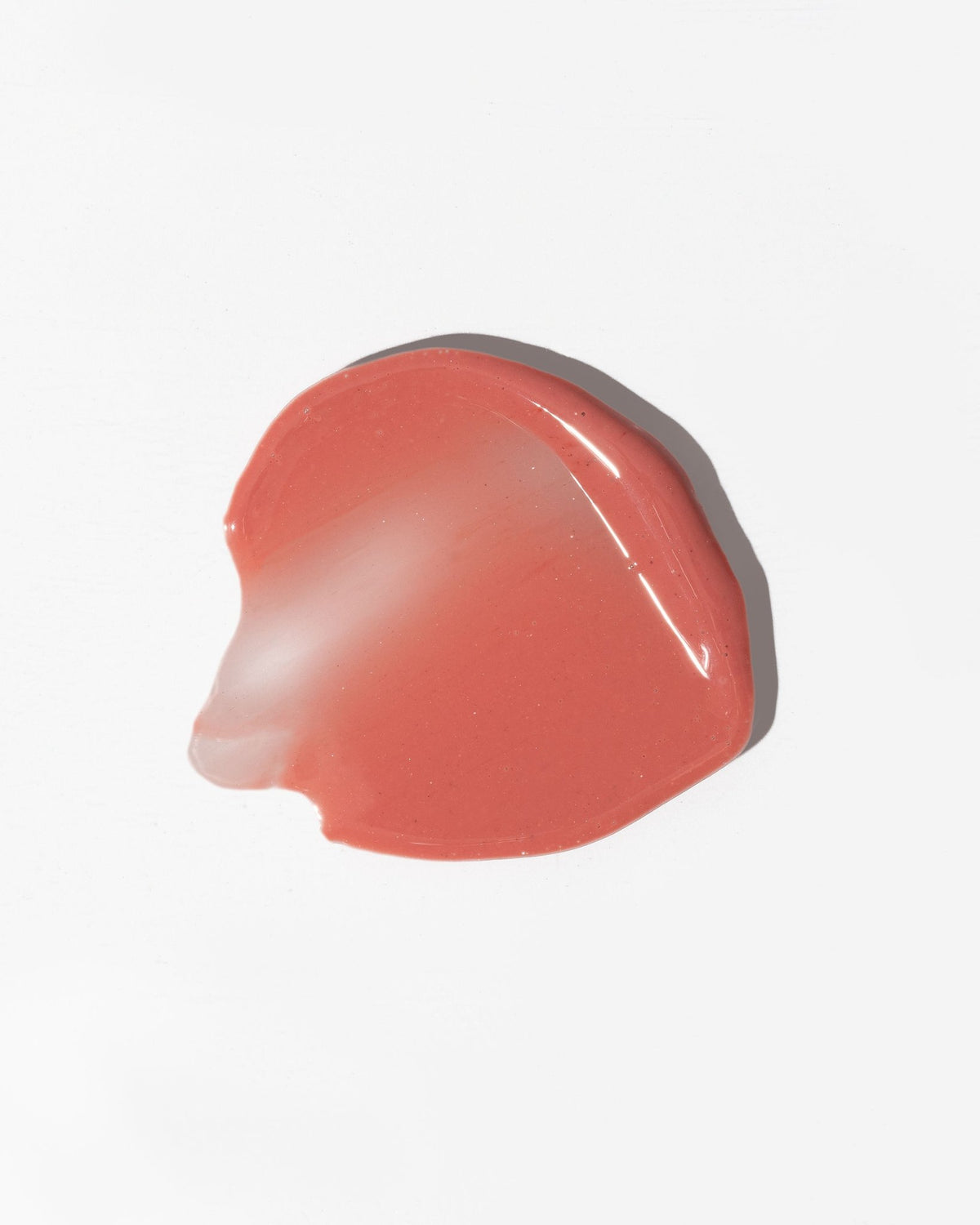 2. Close-up of LUUV Lip Gloss Balm in Fun, showing shimmering pink gloss texture