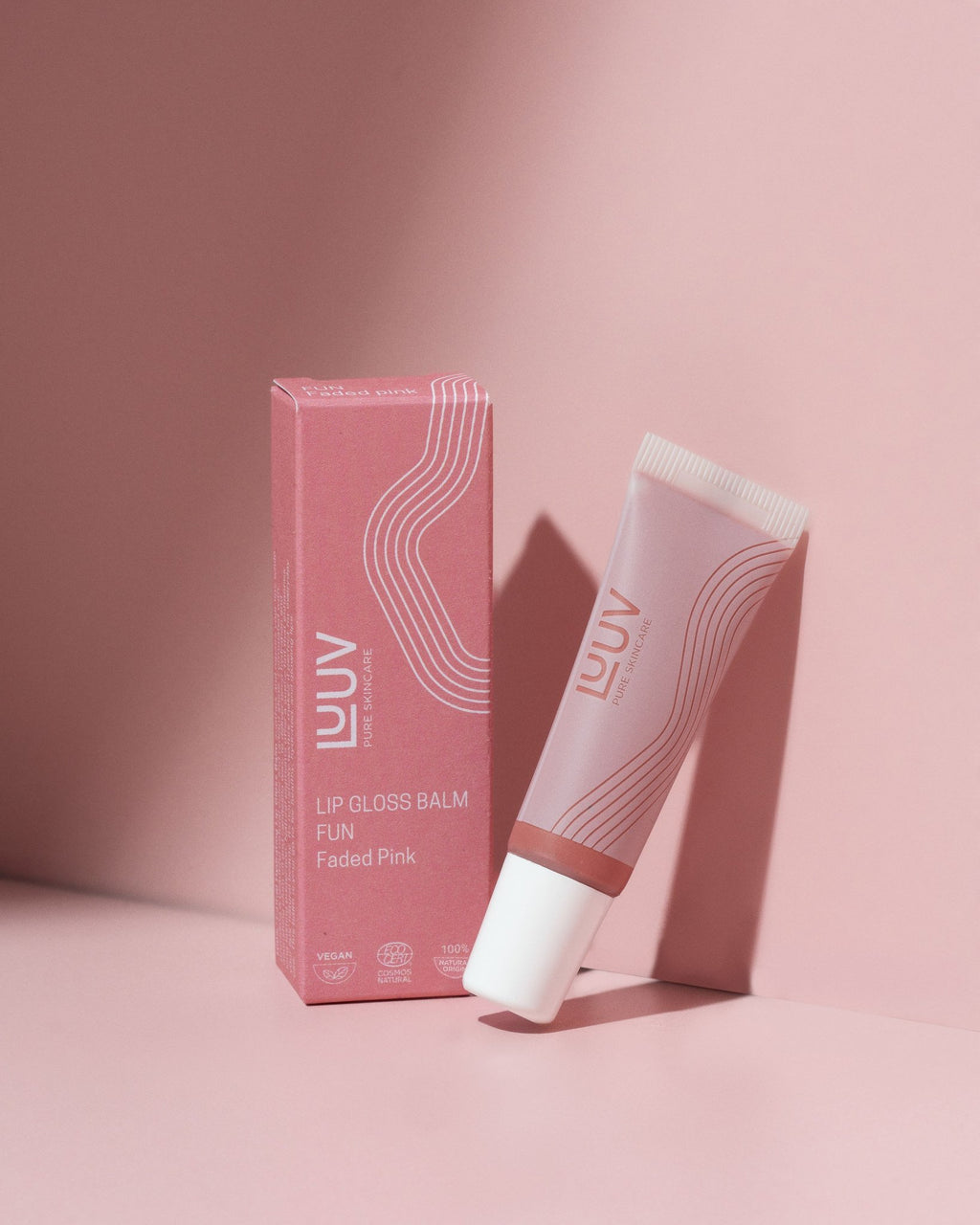 1. LUUV Lip Gloss Balm in Fun with packaging, showcasing faded pink shade and eco-friendly certification