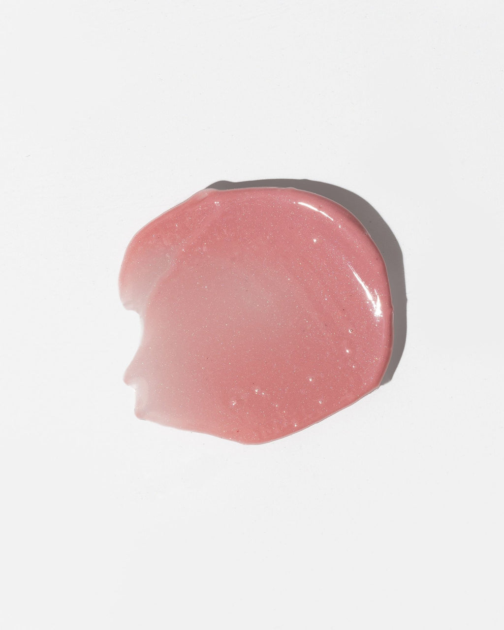 4. Close-up of LUUV Lip Gloss Balm in Sweet, showing shimmering soft pink texture