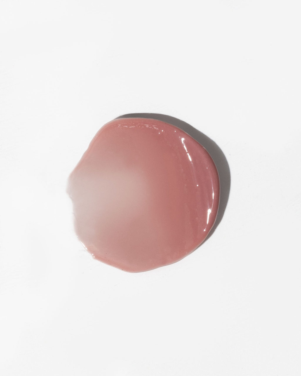 3. Close-up of LUUV Lip Gloss Balm in Dusty Plum showing glossy texture on white background