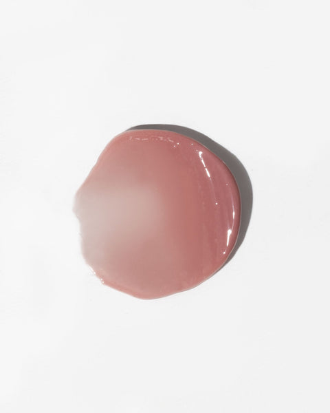 3. Close-up of LUUV Lip Gloss Balm in Dusty Plum showing glossy texture on white background