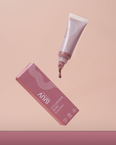 1. LUUV Lip Gloss Balm in Dusty Plum with ECOCERT/COSMOS certification, shown with packaging on a pink background