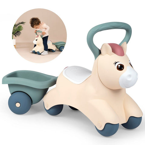 1. Beige ride-on pony with green handle and trailer, featuring a child playing in the background