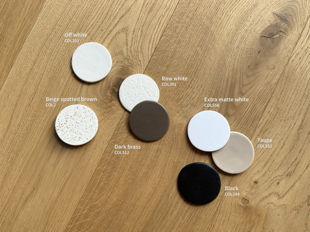 4. Flat lay of ceramic color samples including extra matte white and taupe
